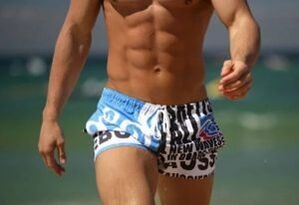 A man in a swimming spin gel to raise a penis gel